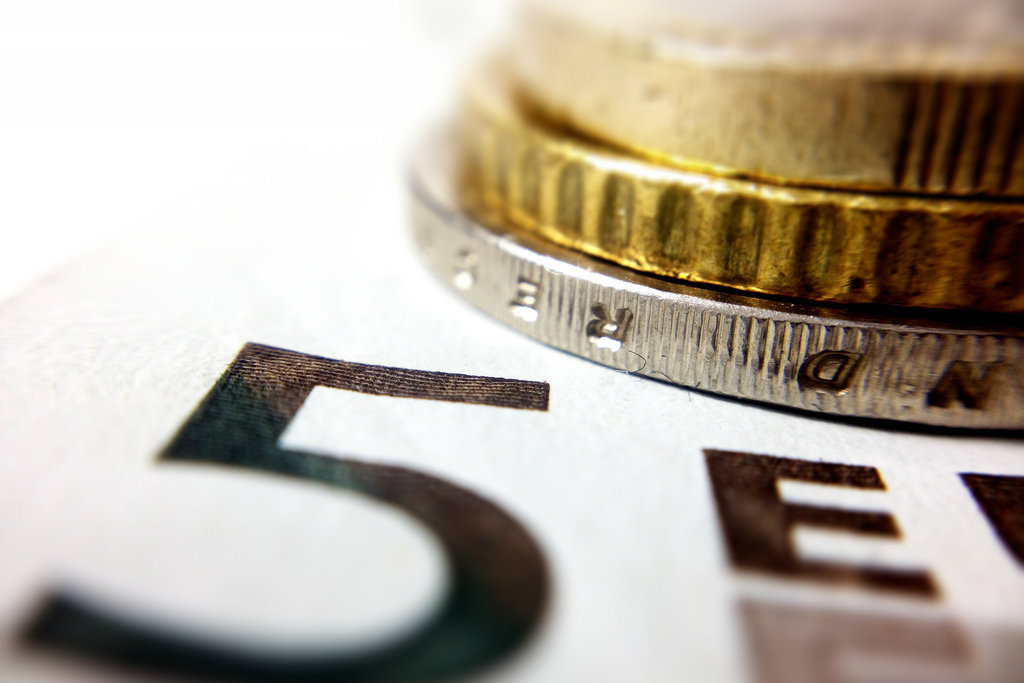 Merkel's cabinet agreed on a minimum wage of €8.50 for Germany's workforce effective 1 January 2015. [Dennis Skley/Flickr]
