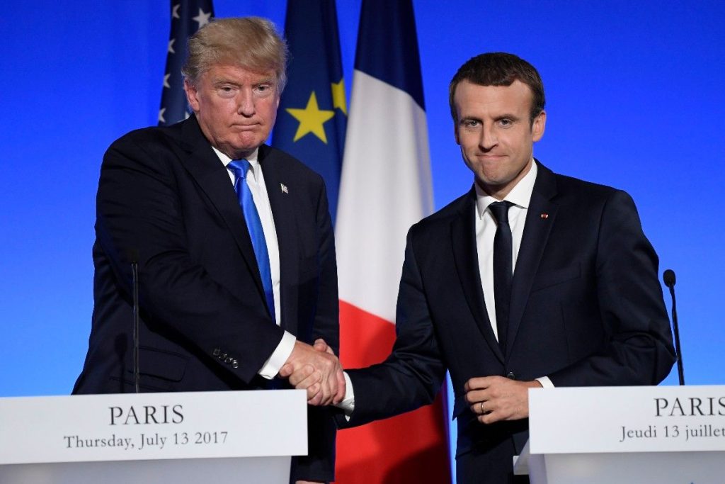 epa06085708 US President Donald J. Trump and French President Emmanuel Macron shake hands at a joint news conference at the Elysee Palace in Paris, France, 13 July 2017. US President Trump earlier arrived for an official visit to Paris.  EPA/JULIEN DE ROSA