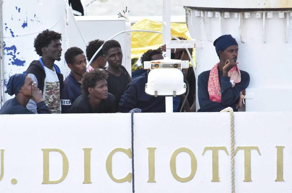 Migrants disembark in the port of Catania