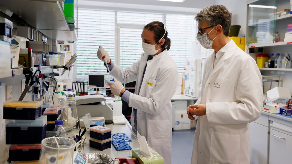 epa08473187 Stephan Becker (R), Head of the Institute of Virology at the University of Marburg and Coordinator of the &lsquo;Emerging Infectious Diseases&rsquo; Division at the German Centre for Infection Research (DZIF), stand with a laboratory employee in a Laboratory at the Institute of Virology at the University in Marburg, Germany, 08 June 2020. The Philipps University of Marburg, the German Centre for Infection Research (DZIF), the Ludwig Maximilian University of Munich (LMU) and the University Medical Centre Hamburg-Eppendorf (UKE) are jointly researching a vaccine against the SARS-CoV-2 coronavirus. Countries around the world are taking increased measures to stem the widespread of the SARS-CoV-2 coronavirus which causes the Covid-19 disease.  EPA-EFE/RONALD WITTEK