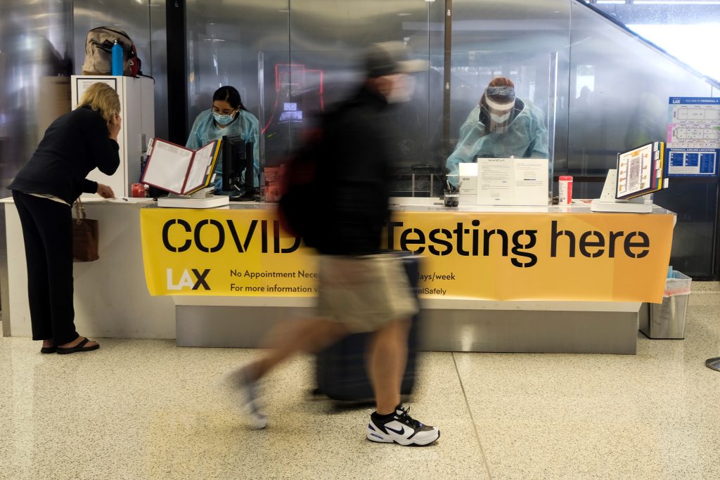 A,Traveler,Walks,By,A,Covid-19,Testing,Site,At,The