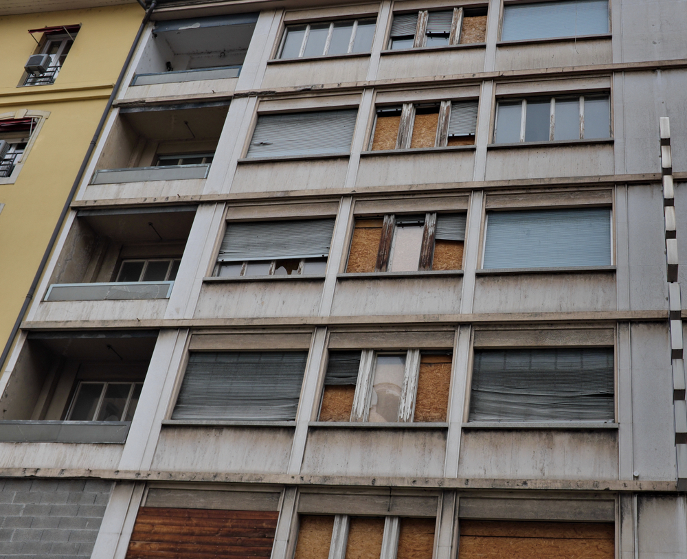 Building,With,Windows,Closed,By,Planks.