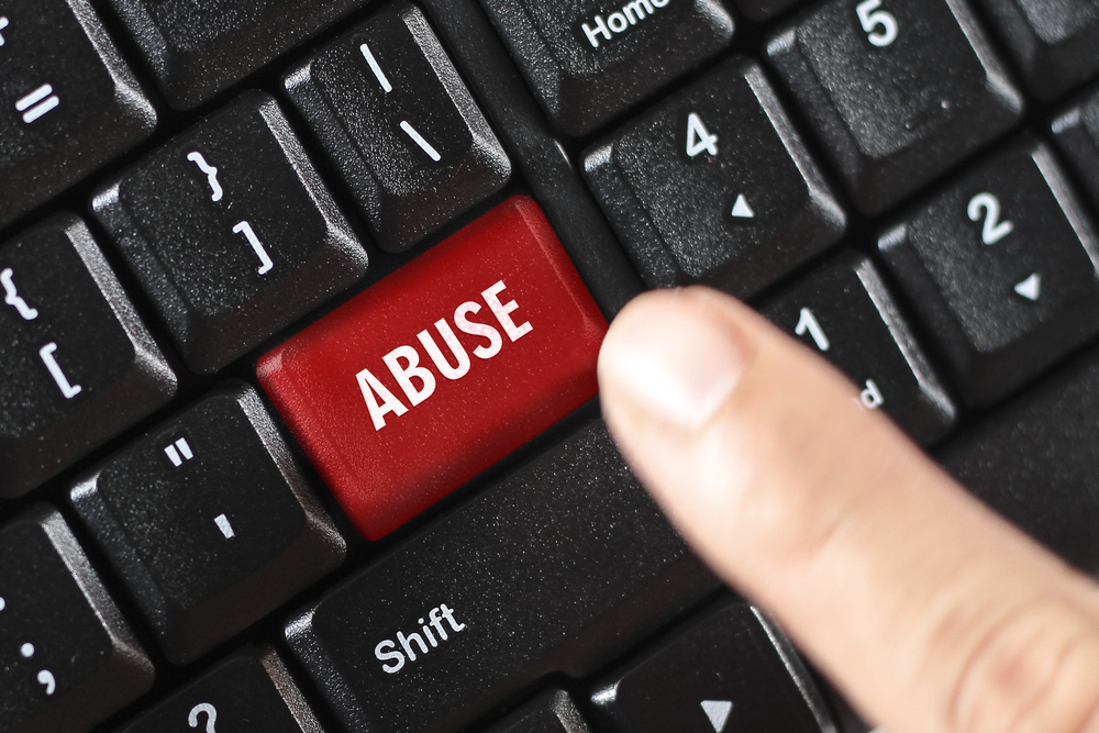 Abuse,Word,On,Red,Keyboard,Button