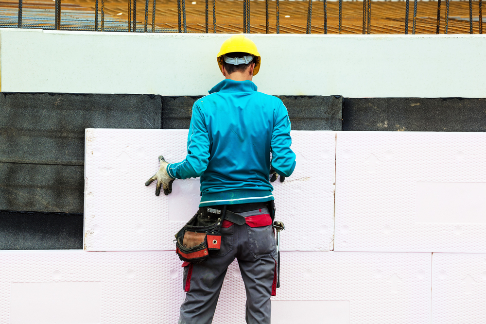 Construction,Workers,At,A,Construction,Site,When,The,Building,Insulation