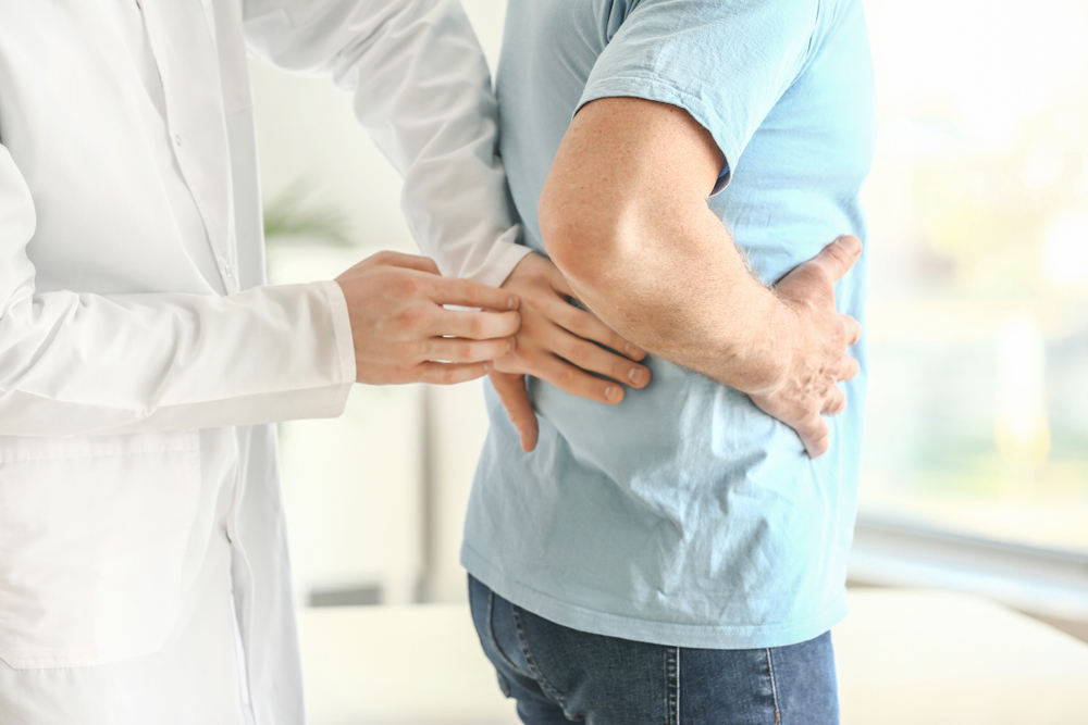 Urologist,Examining,Male,Patient,In,Clinic