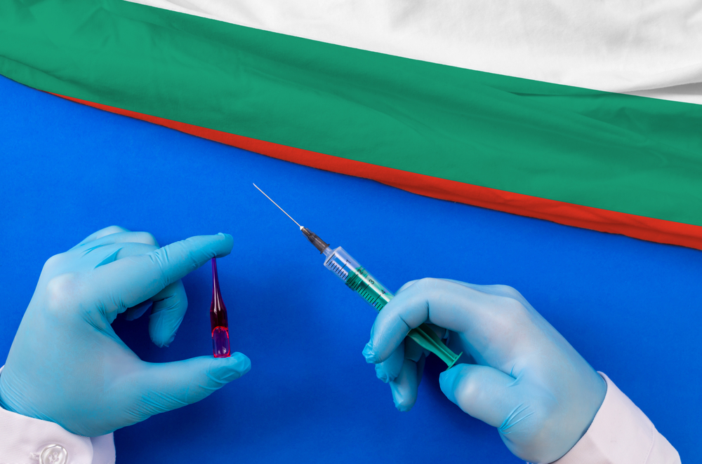 Bulgaria,Vaccination.,Hands,Of,Doctor,Holding,Syringe,And,Coronavirus,(covid-19)