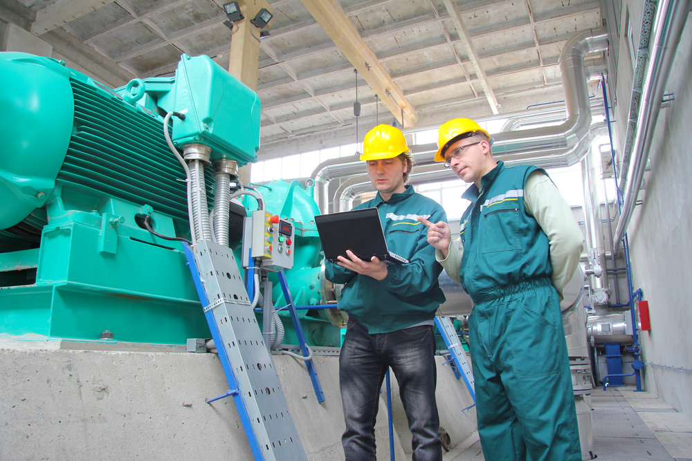Industrial,Workers,With,Notebook,Working,In,Power,Plant,,Teamwork