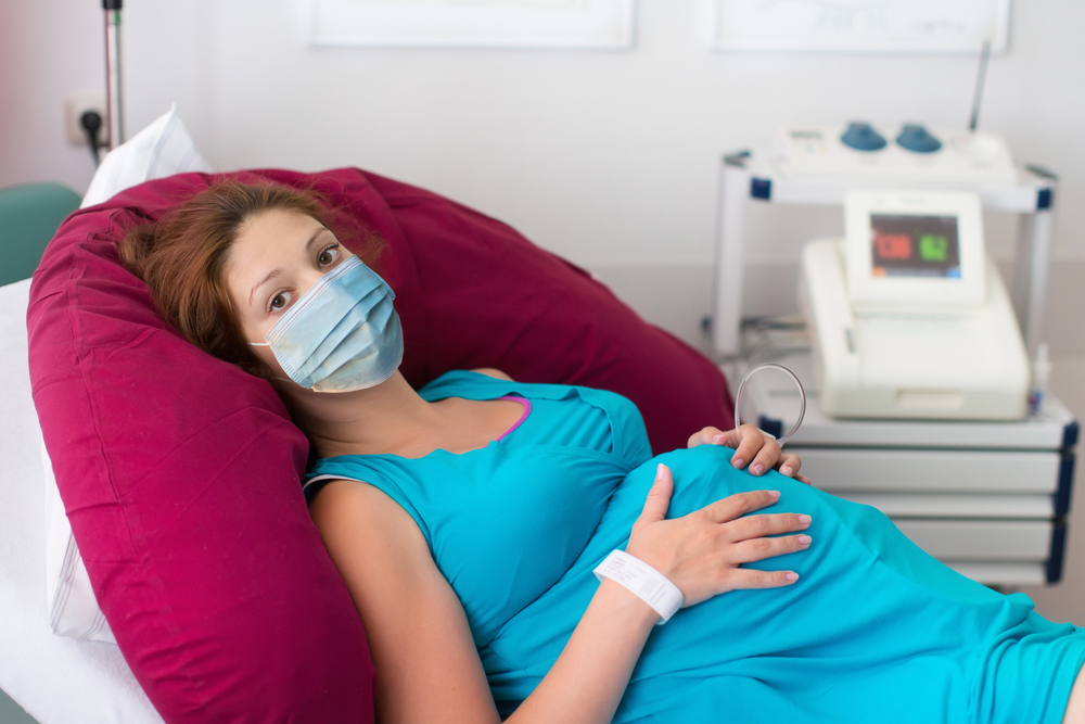 Pregnant,Patient,In,Face,Mask,In,A,Hospital,At,Doctor