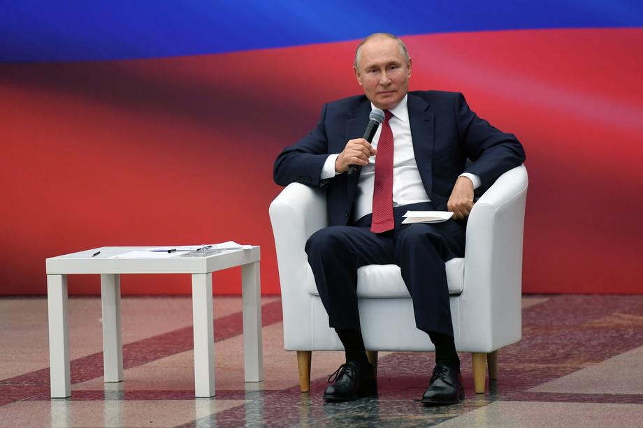 Russian President Vladimir Putin attends a meeting with members of the United Russia party in Moscow