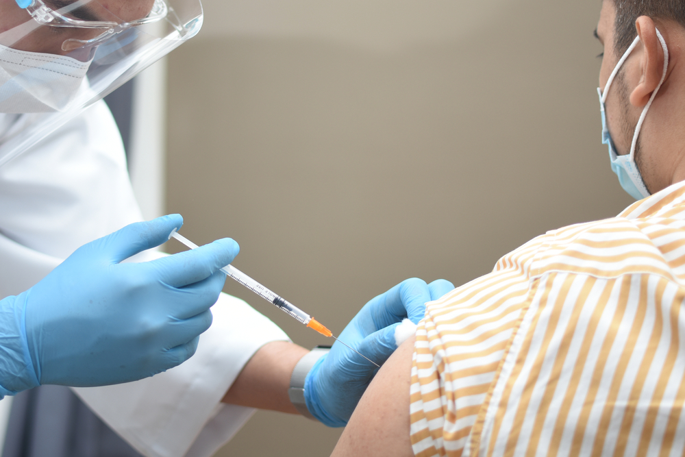 Doctor,In,Medical,Gloves,Giving,Covid-19,,Aids,Or,Flu,Antivirus