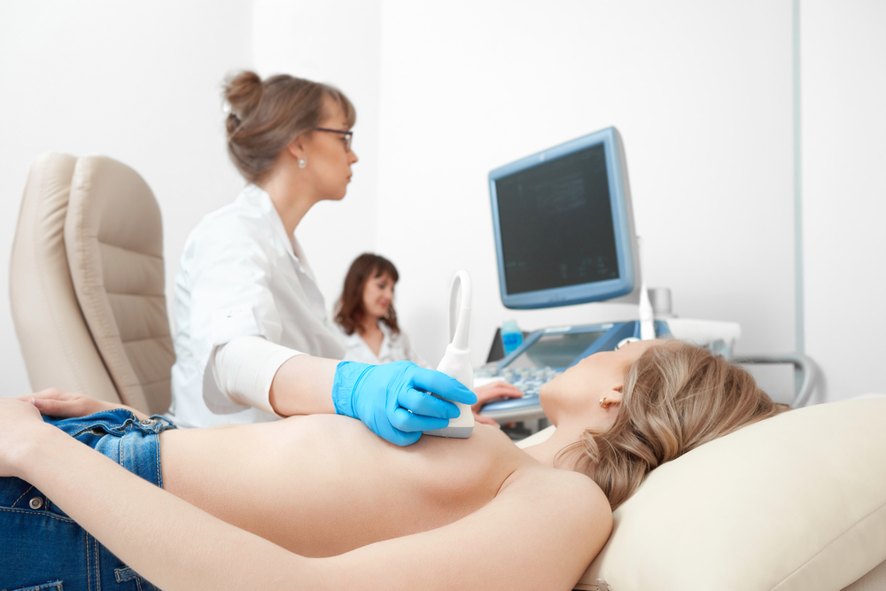Cropped,Close,Up,Of,A,Topless,Woman,Getting,Breast,Sonogram