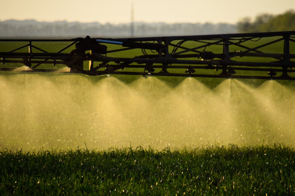 Jets,Of,Liquid,Fertilizer,From,The,Tractor,Sprayer.,Tractor,With