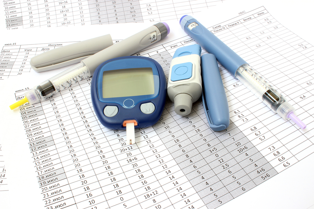 Two,Of,Insulin,And,Glucometer,In,The,Background,Records