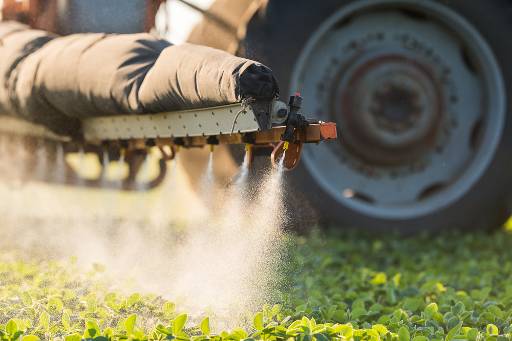Tractor,Spraying,Pesticides,On,Soybean,Field,With,Sprayer,At,Spring