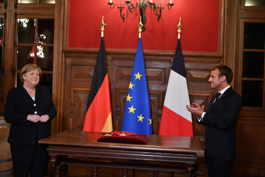 France&rsquo;s President Emmanuel Macron talks with outgoing German Chancellor Angela Merkel