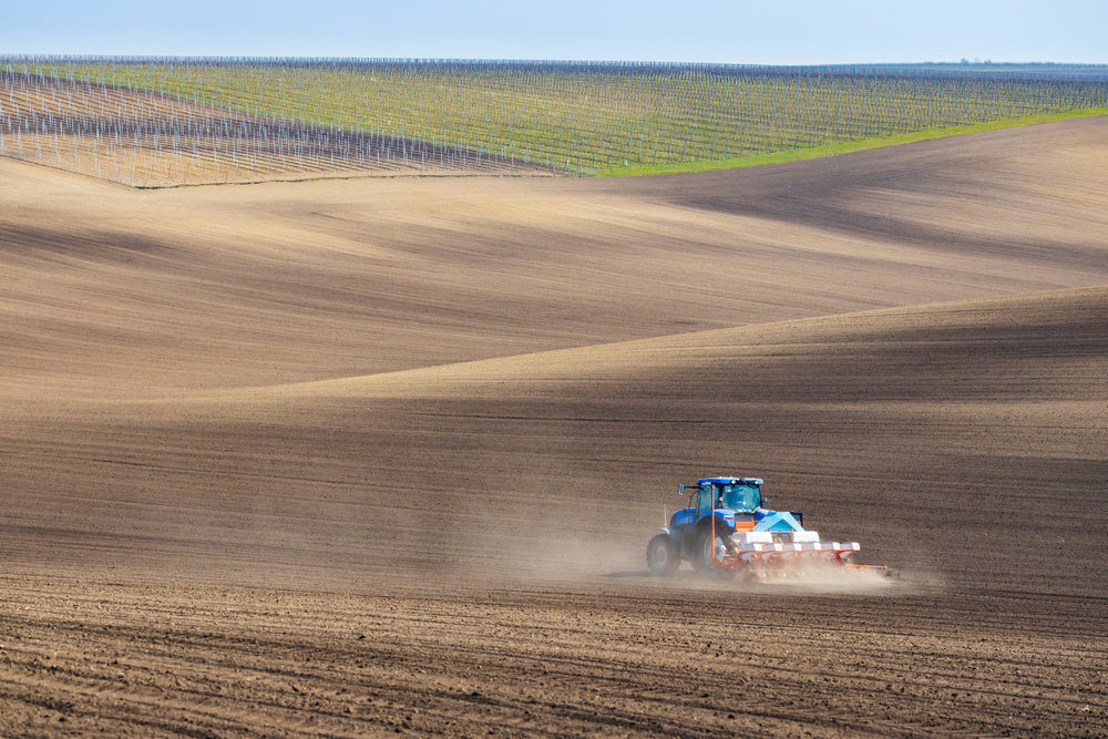 Tractor,With,Seed,Drill,In,Early,Spring,Landscape