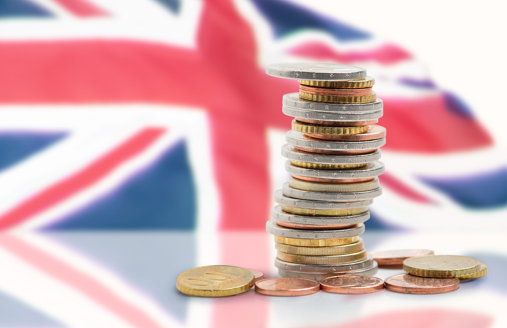Coins,Stacked,On,Each,Other,In,Different,Positions,With,United