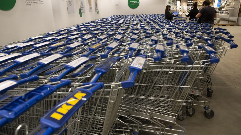 epa09044424 Customers wearing protective face masks as a precaution against the spread of the coronavirus COVID-19 take carts shopping an Ikea store during the reopening day, in Geneva, Switzerland, 01 March 2021. Swiss authorities began the relaxing of measures against the spread of the coronavirus COVID-19 as of 01 March, authorizing the reopening of shops, museums and library reading rooms, along with outdoor sports and leisure facilities, zoos and botanical gardens.  EPA-EFE/SALVATORE DI NOLFI