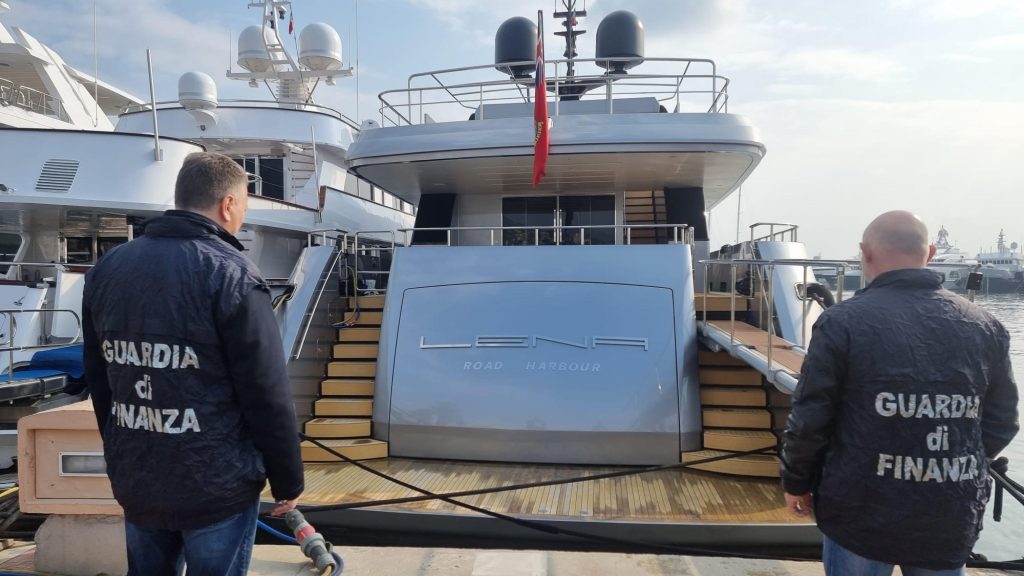 epa09803040 Guardia di Finanza (Italian finance police) officers look at seized maxi yacht &lsquo;Lena&rsquo; in the port of Sanremo, Italy, 05 March 2022. The 52-meter boat with an estimated value of 50 million dollars, is owned by the Russian energy and infrastructure magnate Gennady Timchenko, owner of Volga Group and partner of Novatek. Along with other Russian oligarchs, Timchenko&rsquo;s assets were frozen by the EU on 28 February in response to Russia invading the Ukraine.  EPA-EFE/Fabrizio Tenerelli