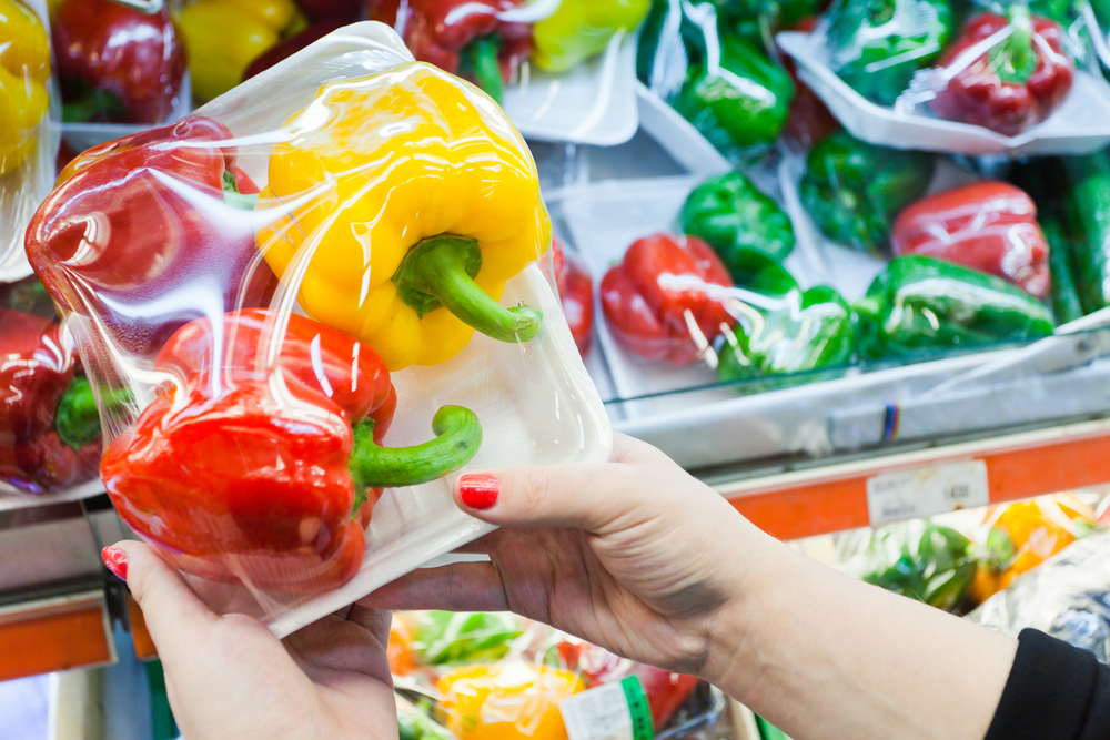 Image,Of,Packaged,Bell,Pepper,With,Woman,Hand,In,The