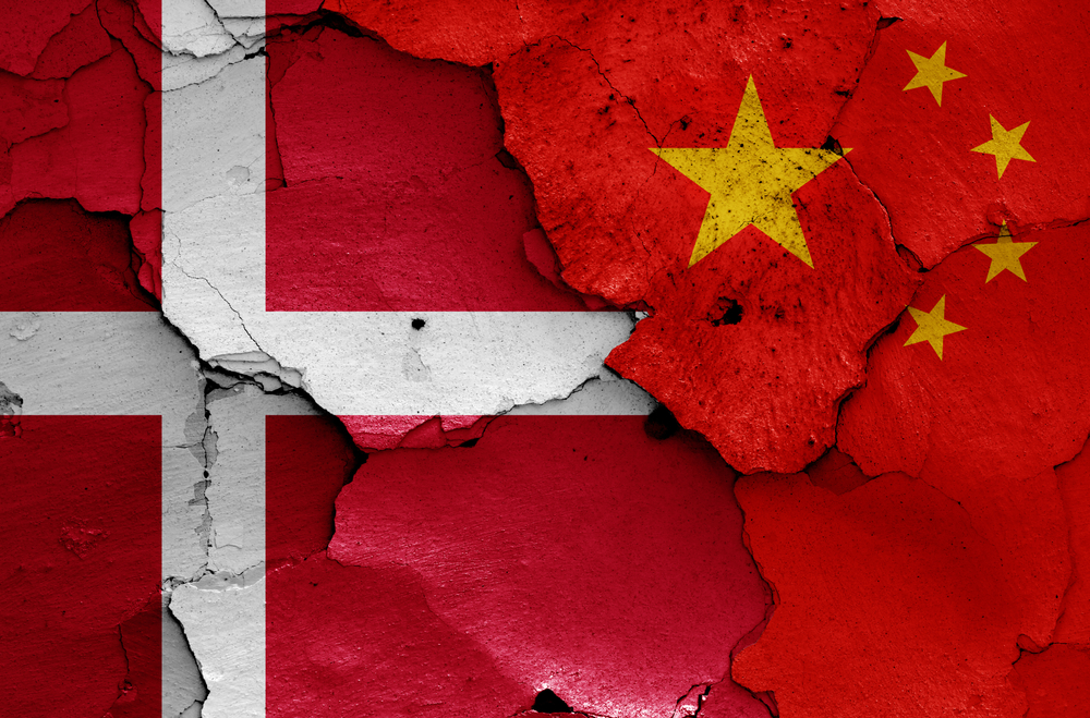 Flags,Of,Denmark,And,China,Painted,On,Cracked,Wall
