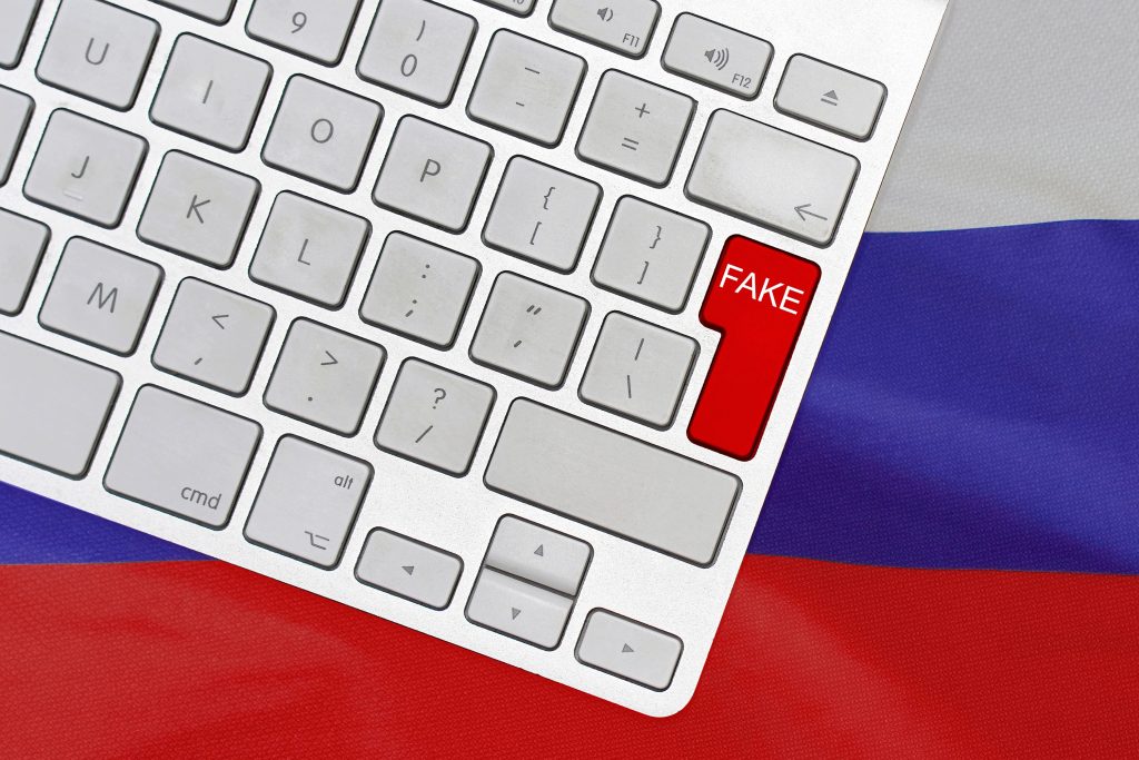 White,Computer,Keyboard,And,Red,Button,With,Word,Fake,On