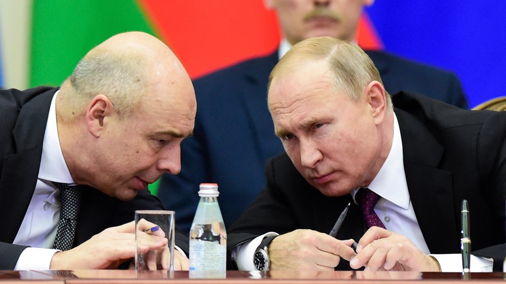 epa07212456 Russian President Vladimir Putin (R) and Russian Finance Minister Anton Siluanov (L) speak during a meeting of the Supreme Council of the Eurasian Economic Union (EAEU), in St.Petersburg, Russia, 06 December 2018. The leaders of Russia, Belarus, Armenia, Kazakhstan and Kyrgyzstan meet to sum up the Council&rsquo;s work over the year and to set key priorities for further deepening of the Eurasian integration, including such spheres as trade, power and digital economy.  EPA-EFE/OLGA MALTSEVA / POOL