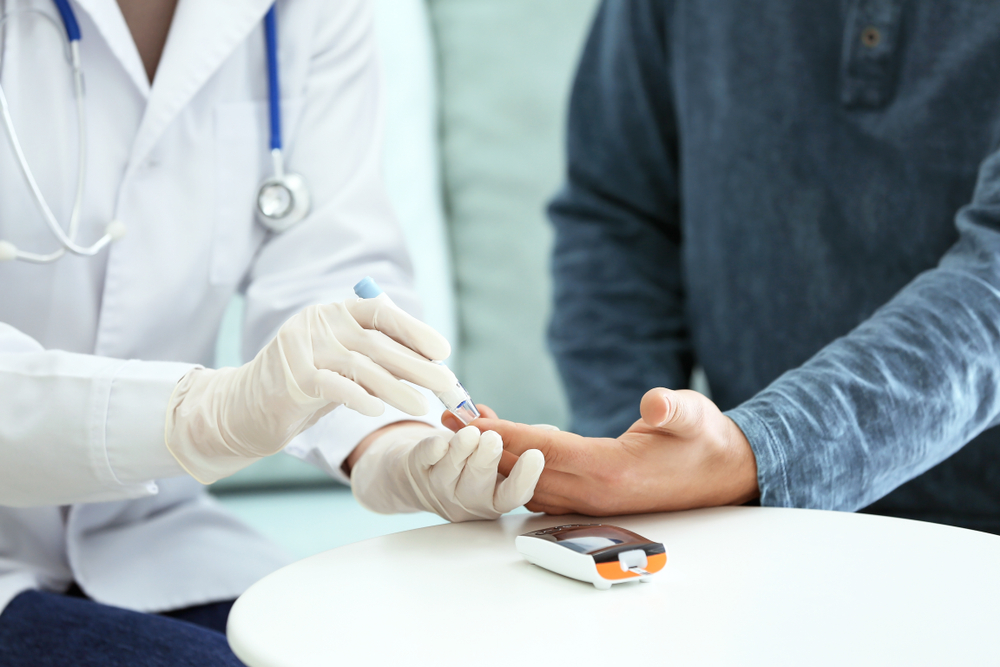 Doctor,Taking,Sample,Of,Diabetic,Patient&rsquo;s,Blood,Using,Lancet,Pen,