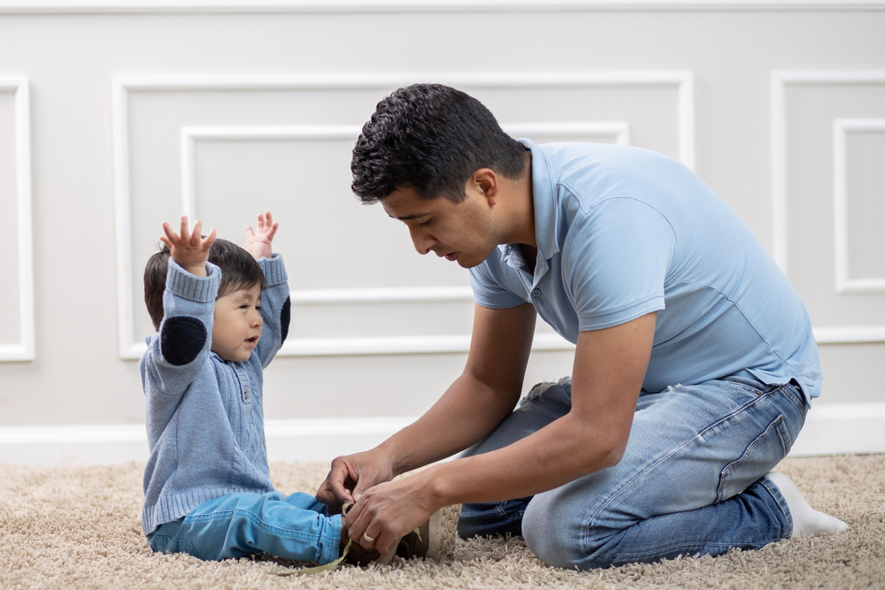 Mexican,Father,Tightening,Shoes,To,Son