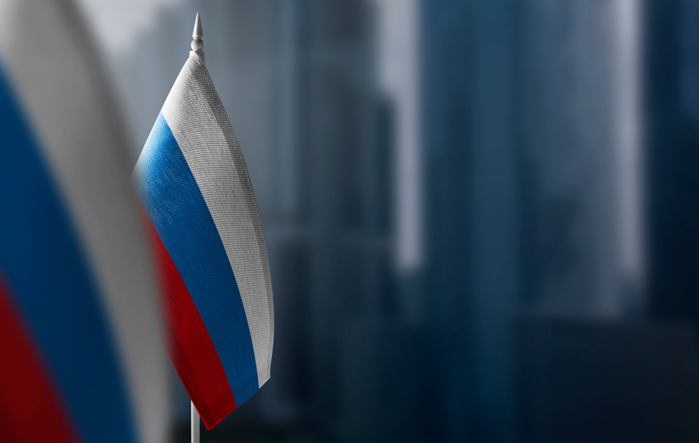 A,Small,Flag,Of,Russia,On,The,Background,Of,A