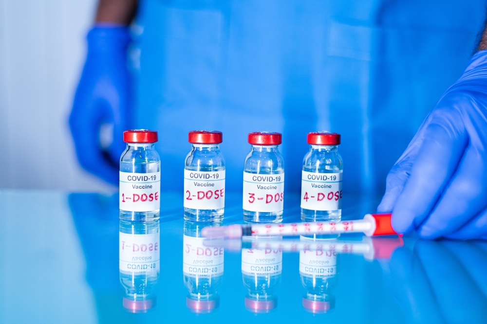 Close,Up,Of,Doctor,Placing,Multiple,Doses,Of,Covid-19,Or