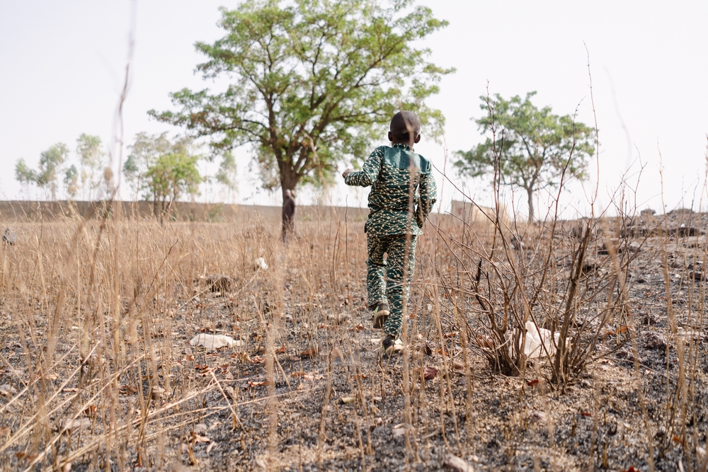 Rear,View,Of,A,Little,Black,African,Boy,Walking,In