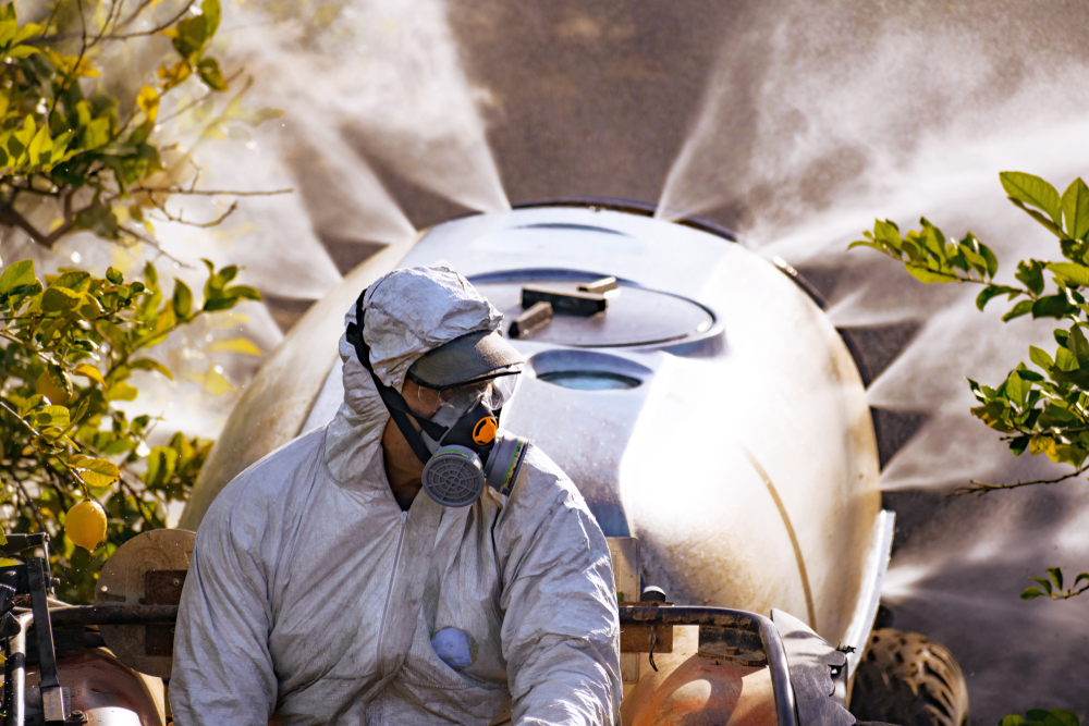 Tractor,Spraying,Pesticide,And,Insecticide,On,Lemon,Plantation,In,Spain.