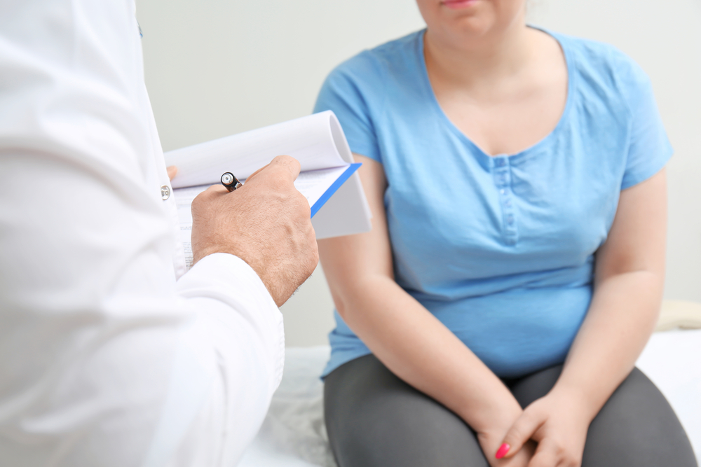 Overweight,Woman,Discussing,Test,Results,With,Doctor,In,Hospital