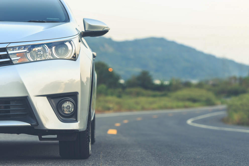 Close,Up,Front,Of,New,Silver,Car,Parking,On,The