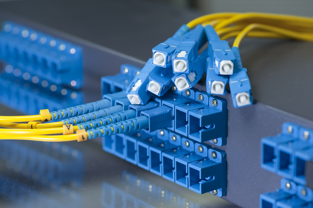 Panel,Of,Fiber,Network,Switch,With,Some,Yellow,Network,Cables