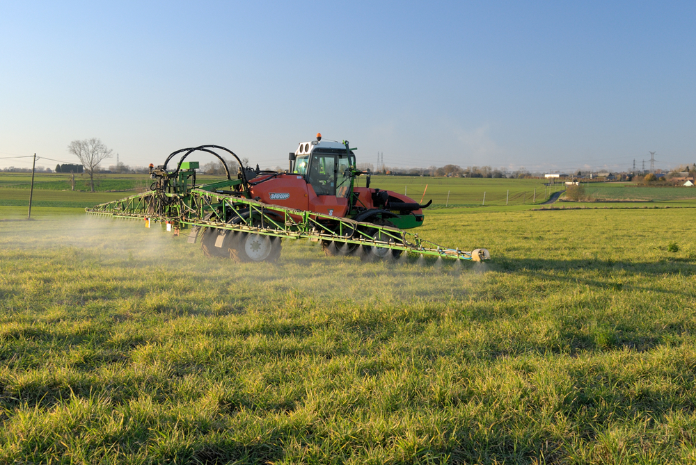 Normandy,,France,,November,2017.,Tractor,Spreading,Round-up,(glyphosate),On,Wheat