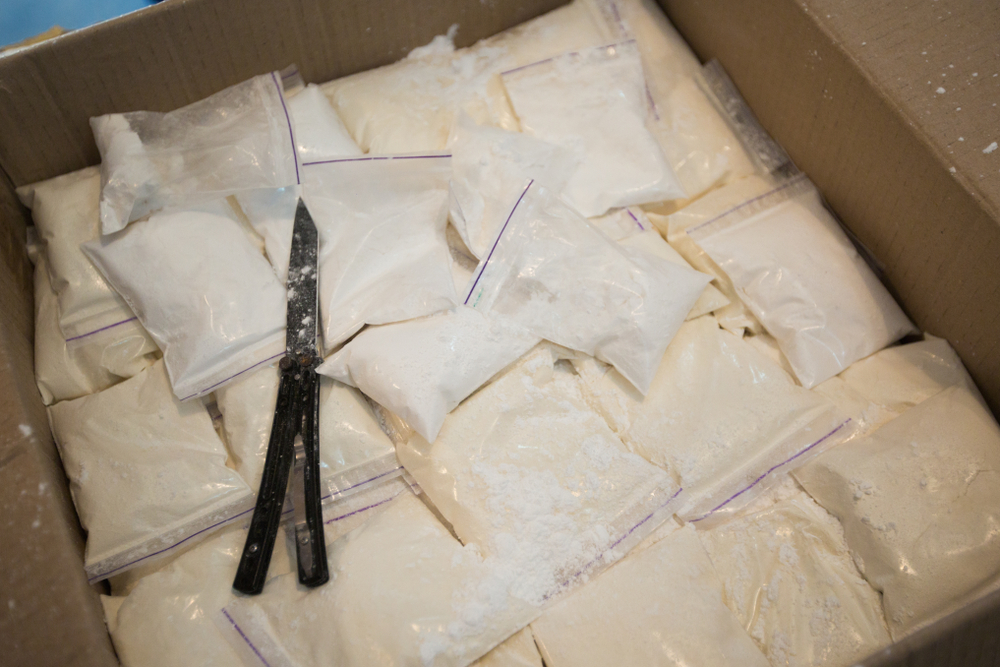 Cocaine,Warehouse.,Close-up,Plastic,Bags,With,Cocaine,In,A,Box.