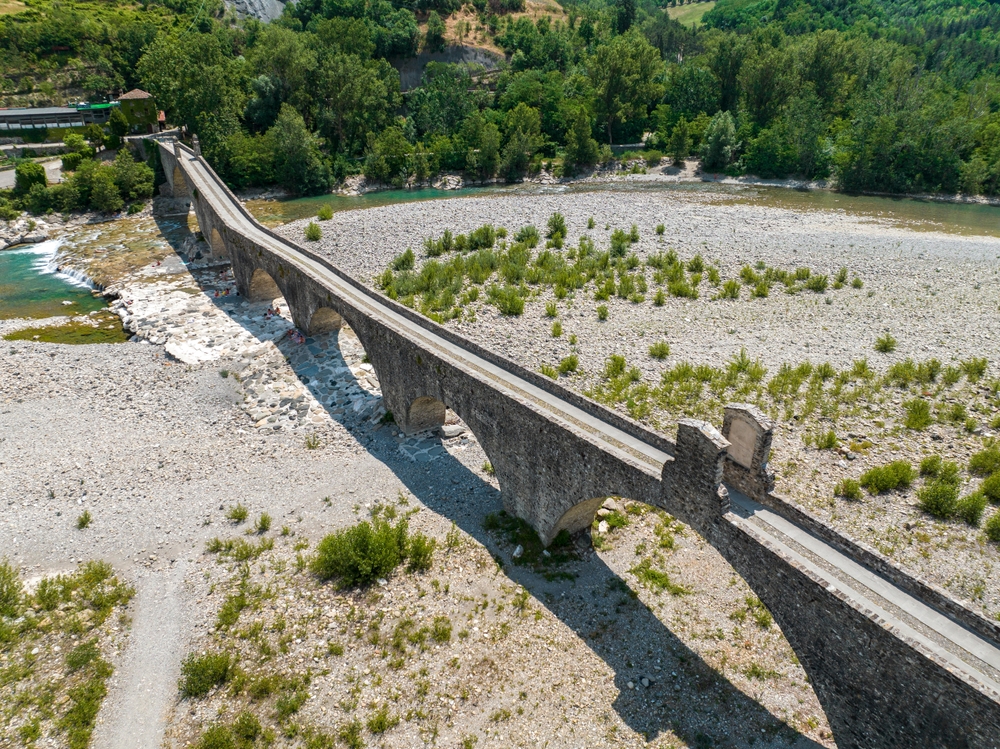 Aerial,View.,Drought,And,Dry,Rivers.,Roman,Bridge,Of,Bobbio