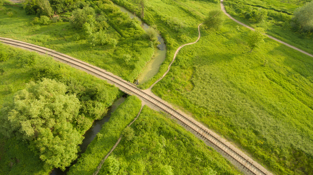 Aerial,View,Of,The,Village,Railway,Going,Across,The,Bridge