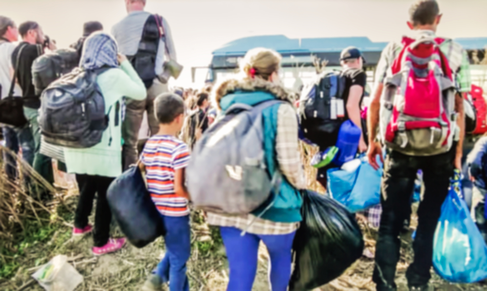 The,Refugees,Migrate,To,Europe.,Blurred,,Bokeh,Background,,Defocused