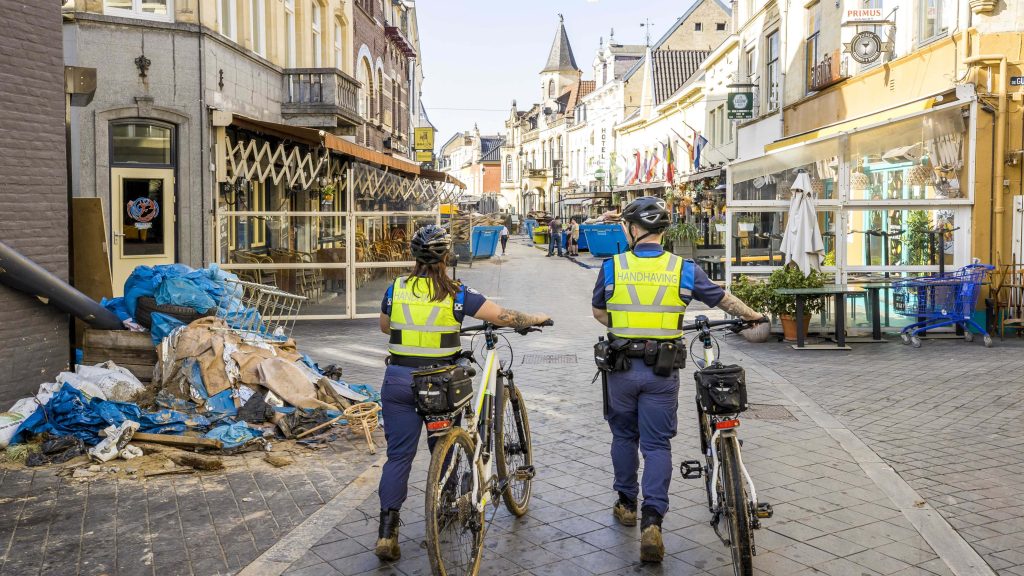 epa09350825 Local enforcement staff patrol the city center of Valkenburg, the Netherlands, 17 July 2021. Shopkeepers from flood-ravaged Valkenburg complained about looting by disaster tourists. Heavy rainfalls have caused widespread damages and floodings in parts of the Netherlands and across central Europe.  EPA-EFE/Marcel Van Hoorn