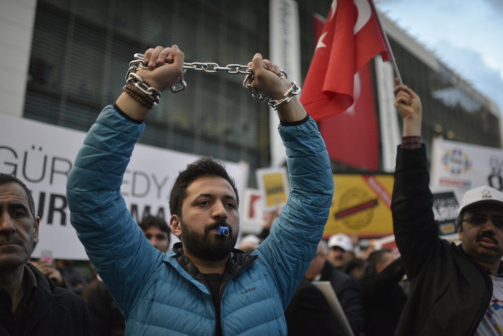 A,Protester,Chaining,Hands,During,Freedom,Of,The,Press,In
