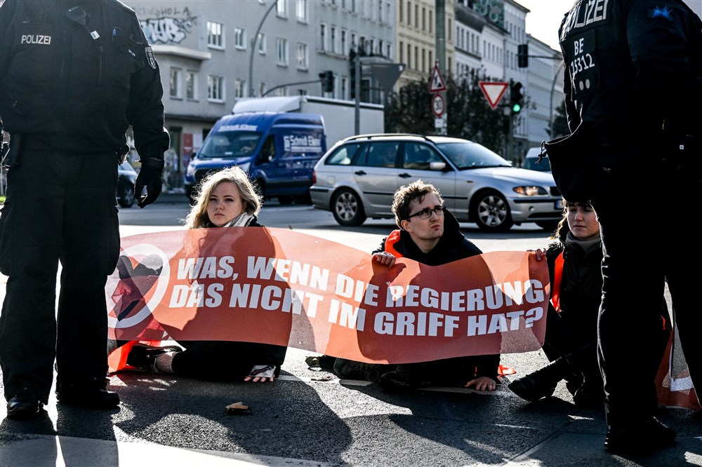 Letzte Generation climate activist blocking traffic in Berlin