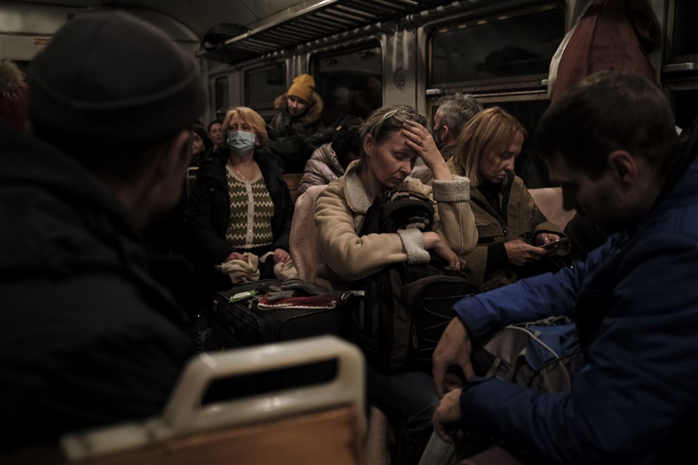 Ukrainians traveling on a train to Lviv, Ukraine from Przemysl in Poland
