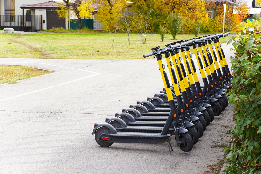 Electric,Scooter,In,The,Parking,Lot,In,The,Park.,There