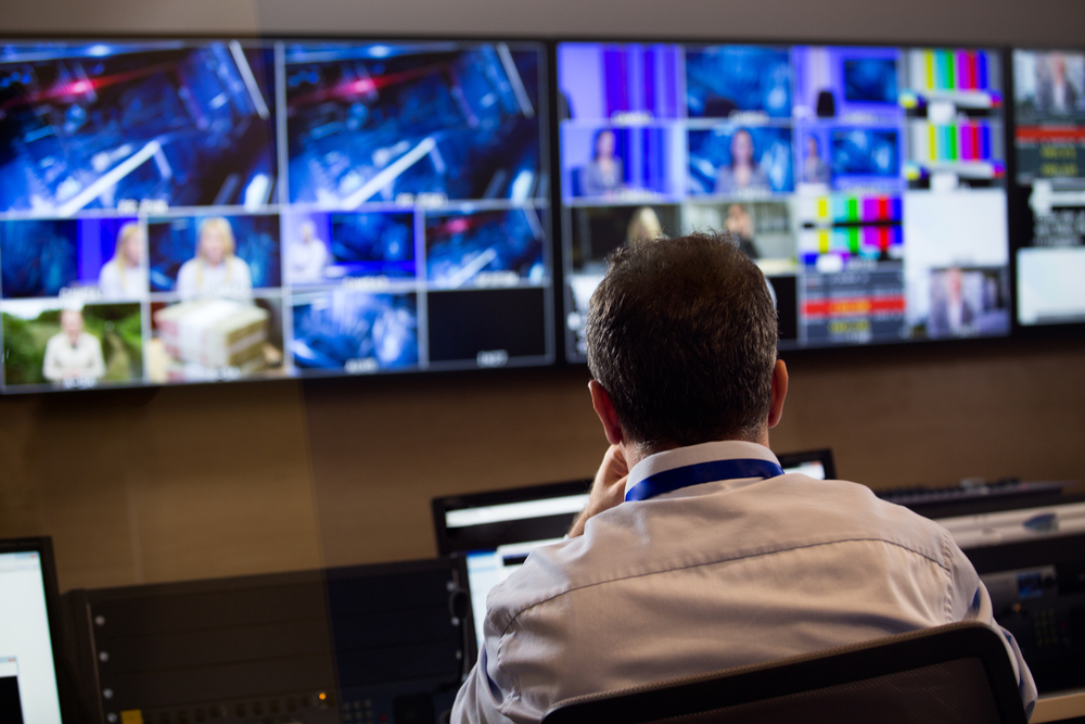 Tv,Director,At,Editor,In,Studio.,Tv,Director,Talking,To