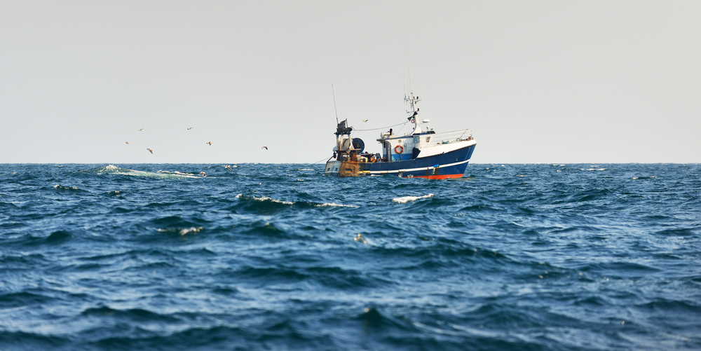 Small,Fishing,Boat,Sailing,In,An,Open,Mediterranean,Sea,,Close-up.
