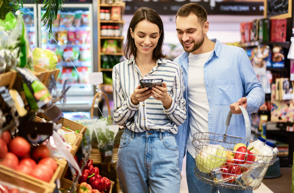 Smiling,Millennial,Couple,Shopping,Groceries,In,The,Hypermarket,,Two,Happy