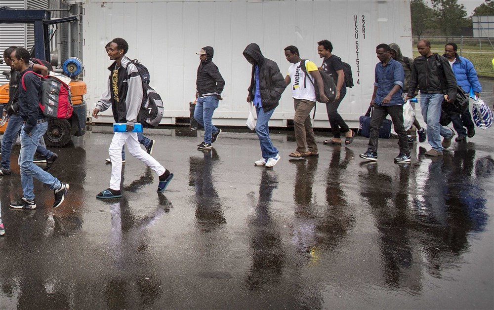 asylum seekers arrive at the Zeelandhallen in Goes